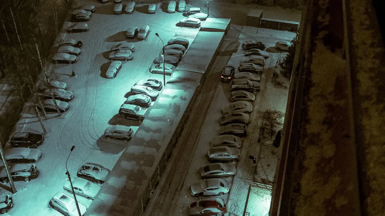 Snow-covered commercial parking lot prepared for winter service
